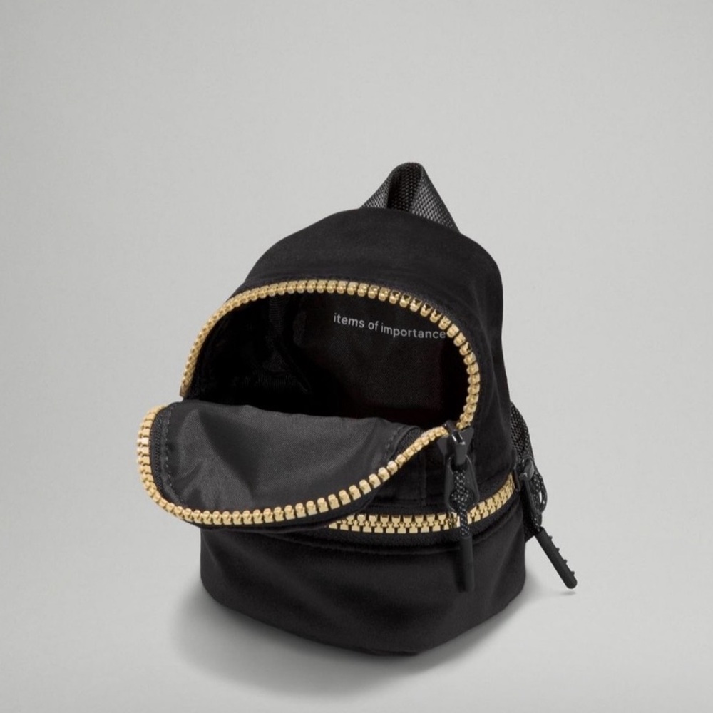 NWOT lululemon athletica City Adventure Black and Gold Mini Bag - Picture 3 of 4
